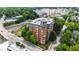 View from above of the brick building with lovely surrounding trees at 710 Independence Pl # 103, Raleigh, NC 27603