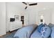 Spacious bedroom features a ceiling fan, dresser, and doorway to a gourmet kitchen at 710 Independence Pl # 103, Raleigh, NC 27603