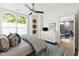 Bright bedroom showcases stylish furnishings, a ceiling fan, and views of the home interior at 710 Independence Pl # 103, Raleigh, NC 27603