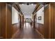 Hallway featuring dark wood floors, white walls, and detailed woodwork at 710 Independence Pl # 103, Raleigh, NC 27603