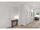 Bright hallway with a wood-look floor and white trim at 710 Independence Pl # 103, Raleigh, NC 27603