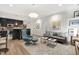 Open-concept living room featuring a modern sofa, kitchen bar, and stylish decor at 710 Independence Pl # 103, Raleigh, NC 27603