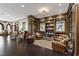 Lobby sitting area with leather chairs, built in bookshelves, and dark wood floors at 710 Independence Pl # 103, Raleigh, NC 27603