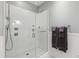 Modern walk-in shower with sleek glass enclosure and chrome fixtures in bathroom at 710 Independence Pl # 103, Raleigh, NC 27603