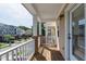 Enjoy the view from this charming balcony with white railings and a wood deck at 717 Samuel Cary Dr, Cary, NC 27511