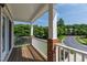Relax on this inviting balcony with brick accents, white railings, and a peaceful view at 717 Samuel Cary Dr, Cary, NC 27511