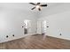 Bedroom featuring luxury vinyl floors, neutral walls, lighting fixture, and two doorway entrances at 717 Samuel Cary Dr, Cary, NC 27511