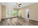 Spacious bedroom features hardwood floors, ceiling fan, and backyard access at 717 Samuel Cary Dr, Cary, NC 27511