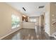 Bright dining area with wood floors, modern light fixtures, and open access to the kitchen at 717 Samuel Cary Dr, Cary, NC 27511