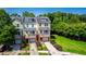 A view of the townhomes with trees and greenery at 717 Samuel Cary Dr, Cary, NC 27511