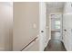 Hallway showing dark LVP flooring leading to a room with natural light at 717 Samuel Cary Dr, Cary, NC 27511