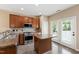 Well-equipped kitchen with island, stainless steel appliances, and access to the backyard at 717 Samuel Cary Dr, Cary, NC 27511