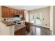 Bright kitchen with island, stainless steel appliances, and convenient access to the outdoors at 717 Samuel Cary Dr, Cary, NC 27511