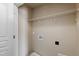 Laundry room featuring a wire shelf, hook, outlet, and washer hookups at 717 Samuel Cary Dr, Cary, NC 27511