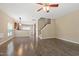 Spacious living room with wood-style floors, modern ceiling fan and plenty of natural light at 717 Samuel Cary Dr, Cary, NC 27511