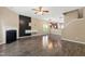 Spacious living room featuring fireplace, modern lighting, and sleek wood-style flooring at 717 Samuel Cary Dr, Cary, NC 27511