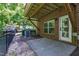 Red brick patio with grass and tree lined backyard at 717 Samuel Cary Dr, Cary, NC 27511
