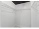 Walk-in closet featuring wire shelving, dark ceiling, and marble floors at 717 Samuel Cary Dr, Cary, NC 27511