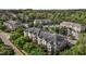 An aerial view of apartments nestled among lush green trees, offering a serene residential community at 735 Portstewart Dr, Cary, NC 27519