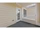View of the house siding and window with white railing and black floor in this outdoor balcony at 735 Portstewart Dr, Cary, NC 27519