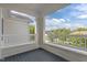 Balcony with black floor, and white banister with a beautiful view of the neighborhood at 735 Portstewart Dr, Cary, NC 27519
