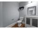 Bathroom showcasing a toilet, modern vanity, decorative mirror, and fixtures at 735 Portstewart Dr, Cary, NC 27519