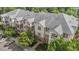 An aerial view of a multi-story condo building with brick and siding and private balconies at 735 Portstewart Dr, Cary, NC 27519