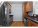 Kitchen features stainless steel appliances, granite countertops, and light wood cabinetry at 735 Portstewart Dr, Cary, NC 27519