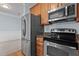 Kitchen features stainless steel appliances, granite countertops, and light wood cabinetry at 735 Portstewart Dr, Cary, NC 27519