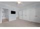 Spacious main bedroom featuring neutral carpet, light blue walls, and ensuite bathroom at 735 Portstewart Dr, Cary, NC 27519