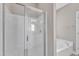 Walk-in shower with a glass door, a soaking tub, and a neutral color scheme at 736 Varina Ln, Fuquay Varina, NC 27526