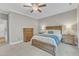 Well-appointed bedroom with a ceiling fan, cozy carpet, and neutral wall colors at 736 Varina Ln, Fuquay Varina, NC 27526