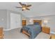 Bedroom featuring carpet, ceiling fan, a large window and ample room for furniture at 736 Varina Ln, Fuquay Varina, NC 27526