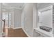 Inviting entryway with hardwood floors, built-in desk space, and neutral wall color at 736 Varina Ln, Fuquay Varina, NC 27526