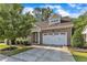 Charming brick home with a two-car garage, landscaped yard, and a welcoming front entrance at 736 Varina Ln, Fuquay Varina, NC 27526