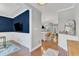 Hallway showcasing hardwood floors, wainscoting, and an open view to the living areas at 736 Varina Ln, Fuquay Varina, NC 27526