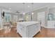 Open-concept kitchen with large island, offering seating and a seamless flow into the living area at 736 Varina Ln, Fuquay Varina, NC 27526
