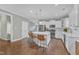 Spacious eat-in kitchen boasts a large island, stainless appliances, and hardwood flooring at 736 Varina Ln, Fuquay Varina, NC 27526