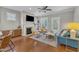 Inviting living room featuring a fireplace, hardwood floors, and ample natural light at 736 Varina Ln, Fuquay Varina, NC 27526