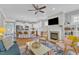 Open-concept living area showcases a modern kitchen and comfortable seating area at 736 Varina Ln, Fuquay Varina, NC 27526