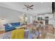 Bright living area with hardwood floors that flow seamlessly into the kitchen and living spaces at 736 Varina Ln, Fuquay Varina, NC 27526