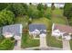 Expansive aerial view of a two-story home showcasing the large backyard and surrounding neighborhood at 7612 Vista Del Rey Ln, Raleigh, NC 27613