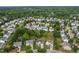 High aerial view showing a dense neighborhood with a large grassy area and tree coverage at 7612 Vista Del Rey Ln, Raleigh, NC 27613