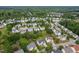 Panoramic view of a neighborhood featuring tree-lined streets and varied home styles at 7612 Vista Del Rey Ln, Raleigh, NC 27613