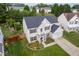 Aerial view of a two-story home with manicured lawn and landscaping at 7612 Vista Del Rey Ln, Raleigh, NC 27613