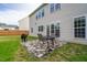 Paver patio with outdoor seating and a grill, perfect for entertaining in the spacious backyard at 7612 Vista Del Rey Ln, Raleigh, NC 27613