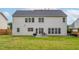 The backyard offers a spacious lawn and patio area, perfect for outdoor gatherings and relaxation at 7612 Vista Del Rey Ln, Raleigh, NC 27613
