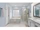 Bathroom featuring a tub, glass enclosed shower and vanity at 7612 Vista Del Rey Ln, Raleigh, NC 27613
