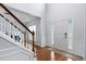 Bright foyer with high ceilings, hardwood floors, staircase, and a front door with sidelights at 7612 Vista Del Rey Ln, Raleigh, NC 27613