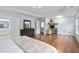 Spacious main bedroom with wood floors, en suite bathroom, and built-in desk area at 7612 Vista Del Rey Ln, Raleigh, NC 27613